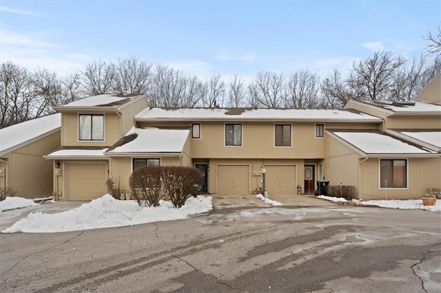 townhome / multi-family property featuring a garage