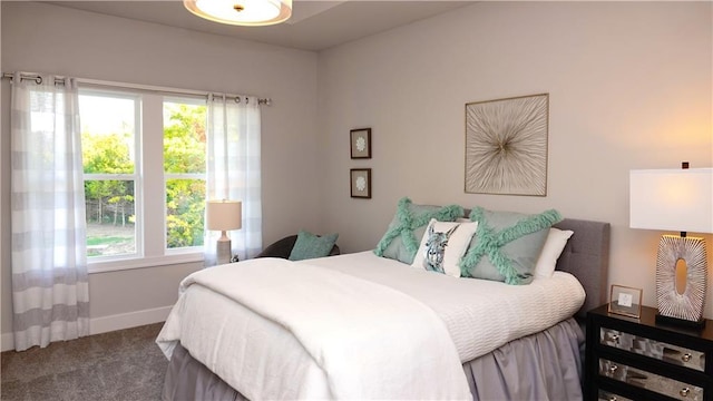 carpeted bedroom with baseboards