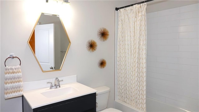 bathroom with vanity, shower / bath combo with shower curtain, and toilet