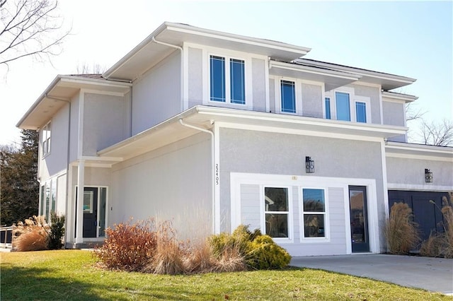 exterior space with a yard and stucco siding