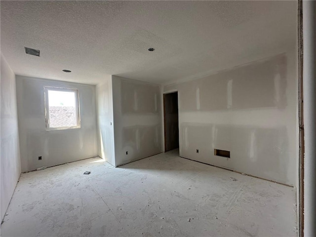 17388 S Kaw St, Olathe, KS 66062 - spare room featuring a textured ceiling