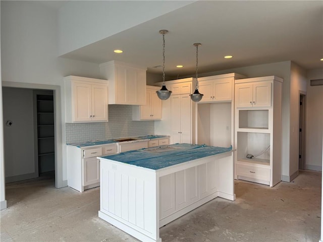 17388 S Kaw St, Olathe, KS 66062 - kitchen with a center island, backsplash, white cabinets, recessed lighting, and hanging light fixtures