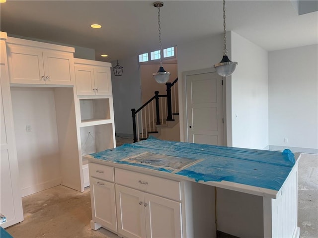 17388 S Kaw St, Olathe, KS 66062 - kitchen featuring white cabinetry, recessed lighting, pendant lighting, unfinished concrete floors, and a kitchen island