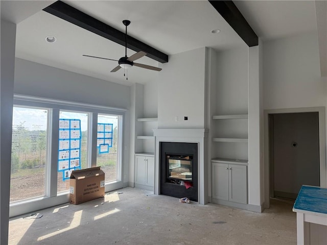 17388 S Kaw St, Olathe, KS 66062 - living room with a glass covered fireplace, ceiling fan, and built in shelves