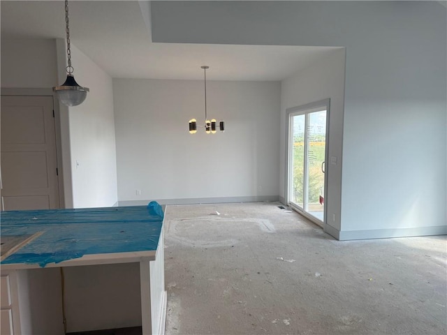 17388 S Kaw St, Olathe, KS 66062 - unfurnished dining area featuring a chandelier and baseboards