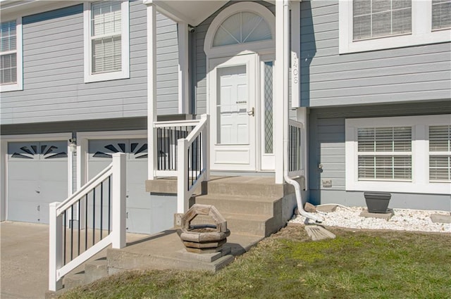 entrance to property with a garage and driveway