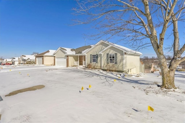 view of front of property with an attached garage and a residential view