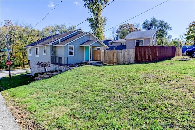 view of front of house featuring a front yard and fence