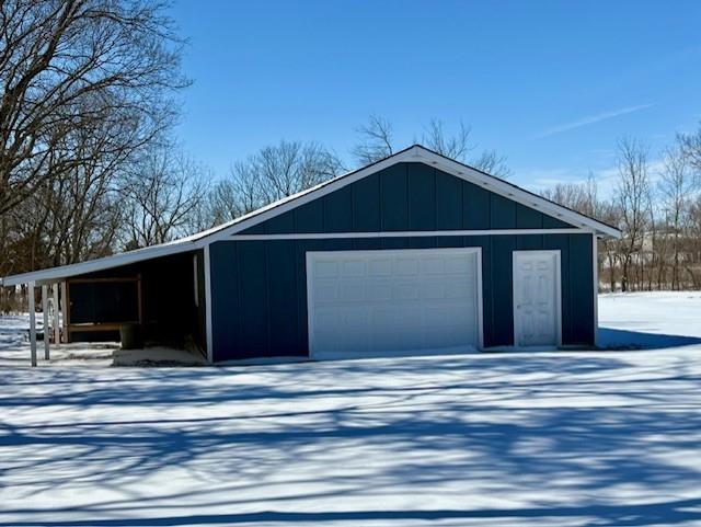 view of snow covered garage