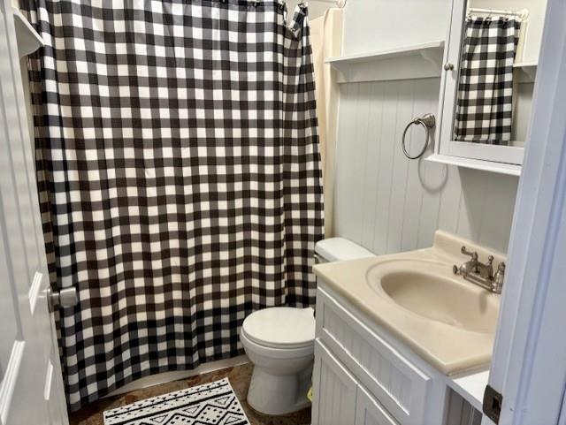 bathroom with toilet and vanity