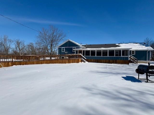 view of snow covered house