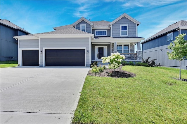 view of front of house with concrete driveway, a porch, an attached garage, and a front yard