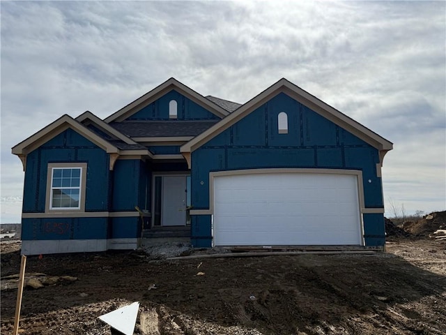 view of front of property featuring an attached garage