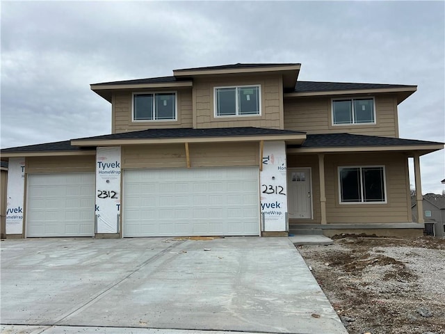 view of front of house featuring a garage and concrete driveway