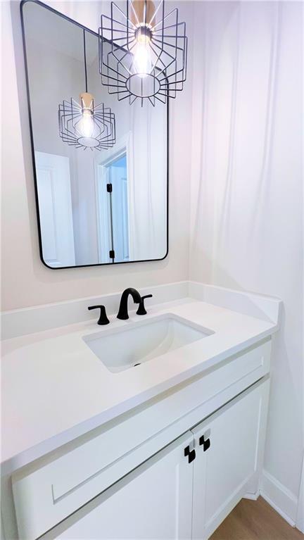 22312 W 76th St, Shawnee, KS 66227 - bathroom featuring vanity and a chandelier