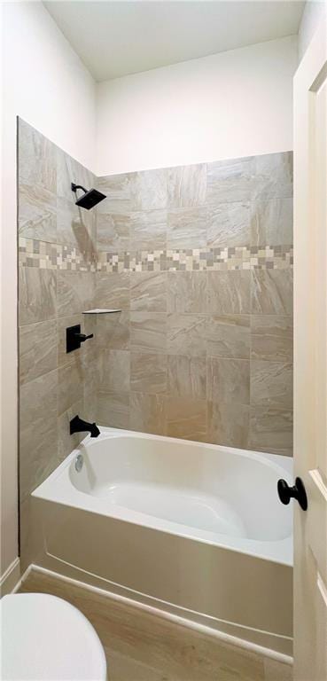 22312 W 76th St, Shawnee, KS 66227 - full bath with shower / bath combination and wood finished floors