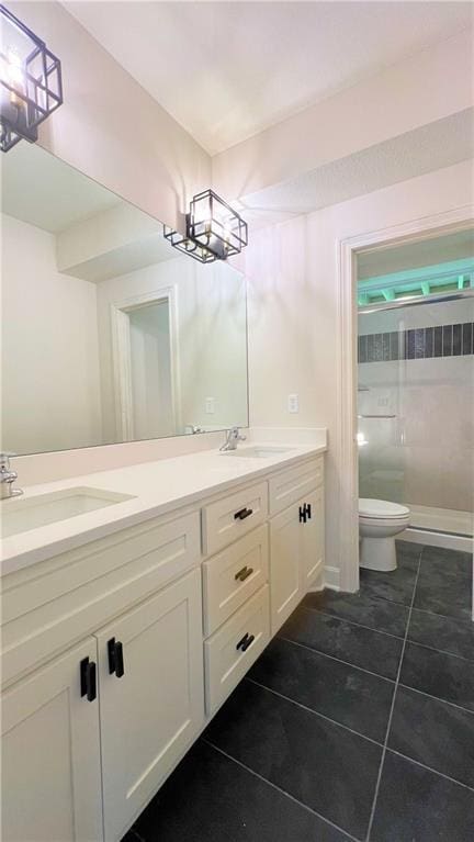 22312 W 76th St, Shawnee, KS 66227 - full bathroom with tile patterned floors, double vanity, and walk in shower