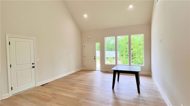22312 W 76th St, Shawnee, KS 66227 - entryway with high vaulted ceiling, light wood finished floors, and recessed lighting