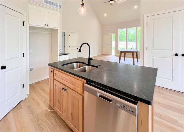 22312 W 76th St, Shawnee, KS 66227 - kitchen with stainless steel dishwasher, light wood-style floors, an island with sink, high vaulted ceiling, and hanging light fixtures