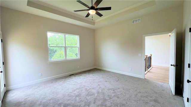 22312 W 76th St, Shawnee, KS 66227 - empty room with a tray ceiling, ornamental molding, carpet floors, and ceiling fan