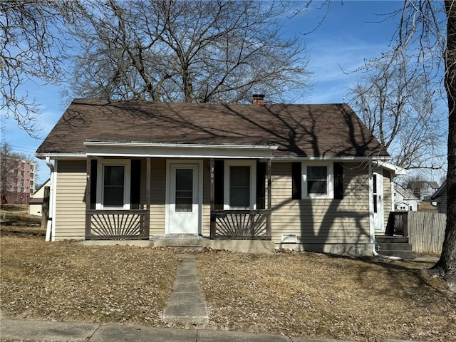 view of front of property featuring a porch and a chimney