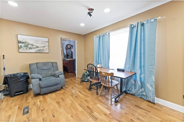 home office with baseboards, wood finished floors, and recessed lighting