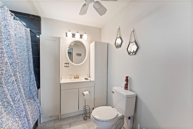 bathroom featuring toilet, ceiling fan, vanity, and a shower with shower curtain