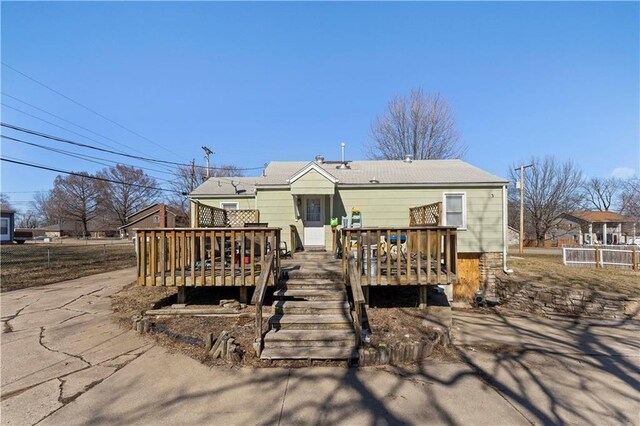 rear view of house with a wooden deck