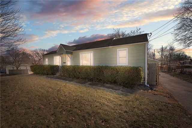 view of side of property featuring a yard