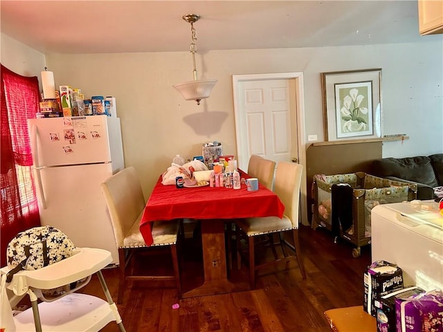 dining area with dark wood-style floors