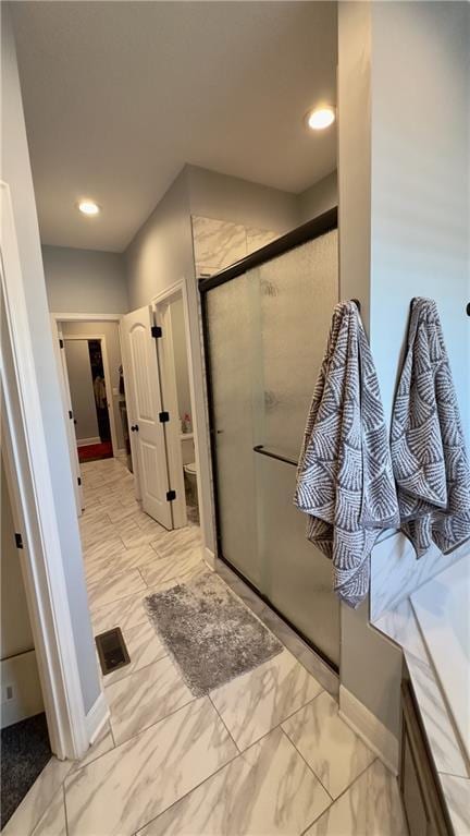 bathroom with a tub to relax in, marble finish floor, recessed lighting, visible vents, and a shower stall