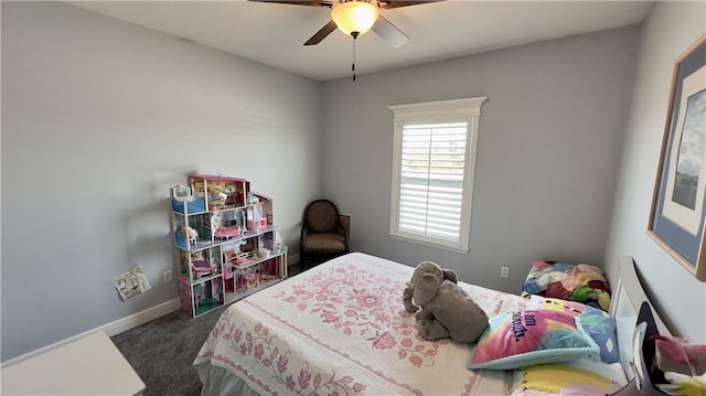 bedroom with ceiling fan, baseboards, and dark colored carpet