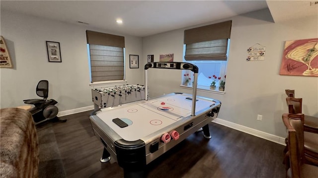 rec room with dark wood-type flooring and baseboards