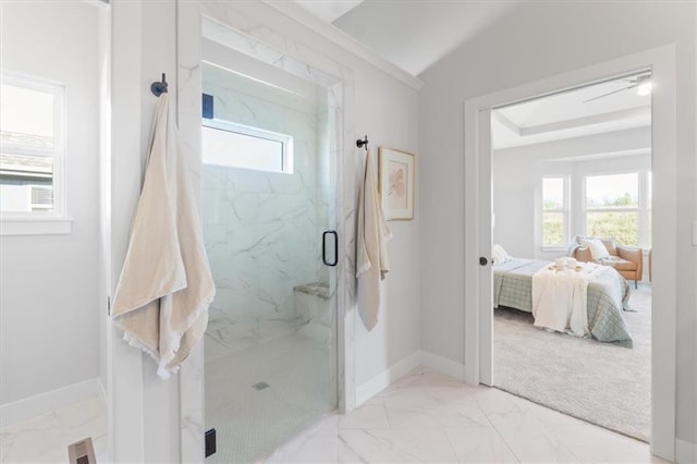 ensuite bathroom featuring a marble finish shower, marble finish floor, baseboards, and ensuite bath