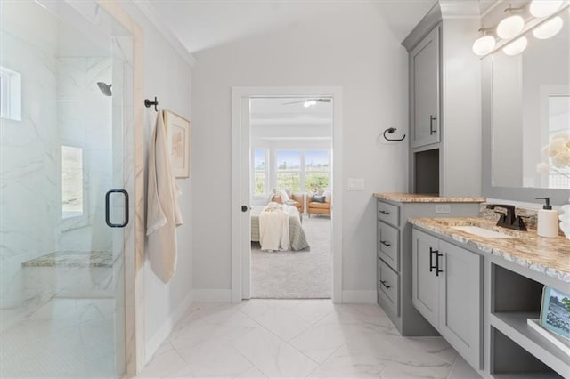 ensuite bathroom featuring lofted ceiling, ensuite bathroom, a marble finish shower, vanity, and marble finish floor