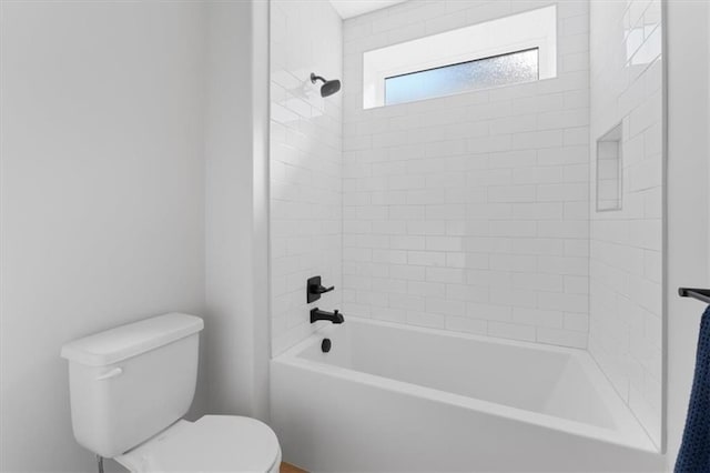 bathroom with toilet and bathtub / shower combination