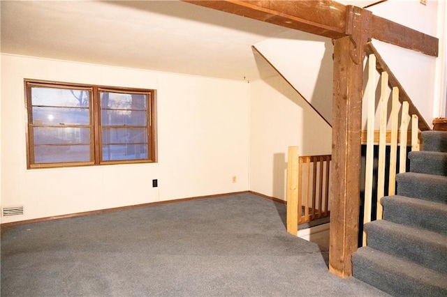 interior space with baseboards, stairs, visible vents, and carpet flooring