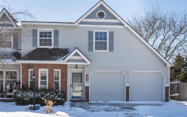 view of front of property with a garage and brick siding