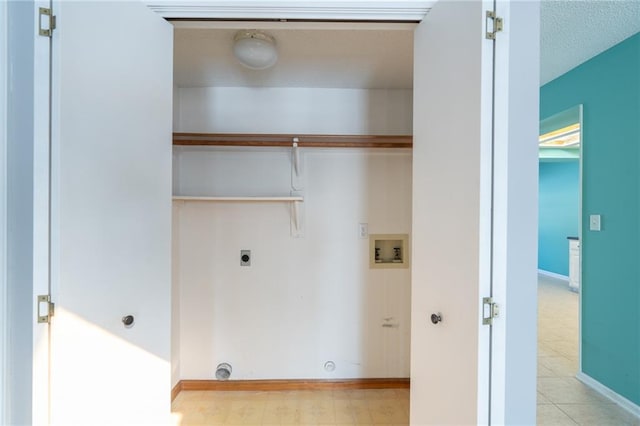 laundry area with light floors, hookup for a washing machine, hookup for an electric dryer, laundry area, and baseboards