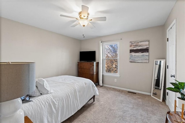 bedroom with visible vents, carpet flooring, a ceiling fan, and baseboards