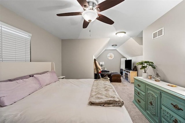 bedroom with visible vents, light carpet, a ceiling fan, and vaulted ceiling