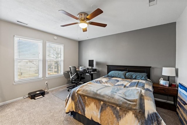 bedroom featuring a ceiling fan, carpet flooring, baseboards, and visible vents