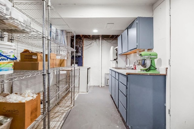 storage featuring washer / dryer and a sink