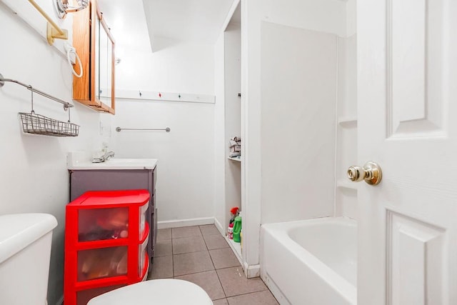 full bathroom with baseboards, vanity, toilet, and tile patterned floors