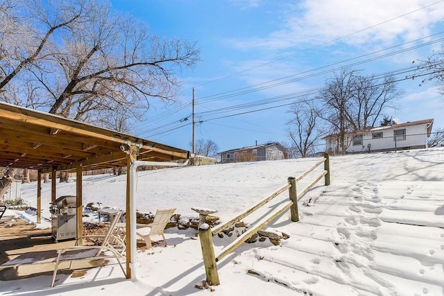 view of yard layered in snow