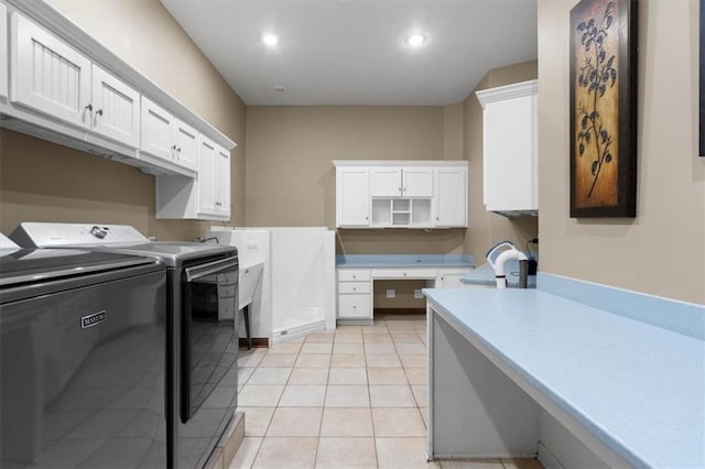 clothes washing area featuring light tile patterned floors, separate washer and dryer, cabinet space, and recessed lighting