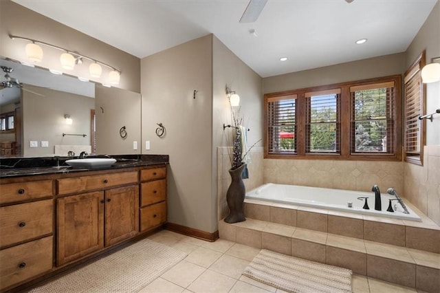 full bathroom featuring baseboards, a ceiling fan, tile patterned floors, vanity, and a bath