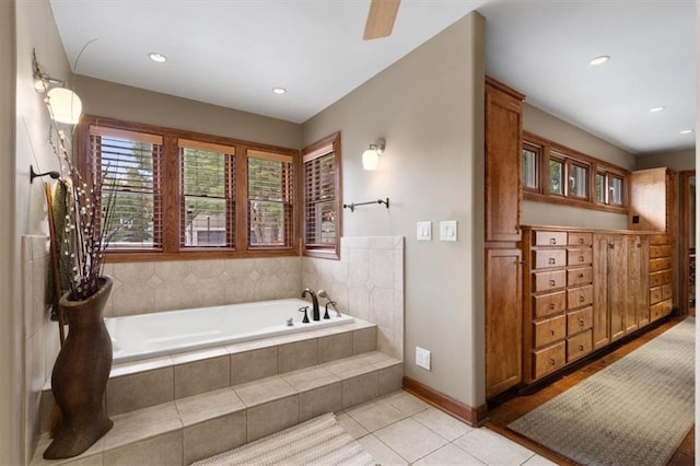 full bath featuring tile patterned flooring, baseboards, a bath, and recessed lighting