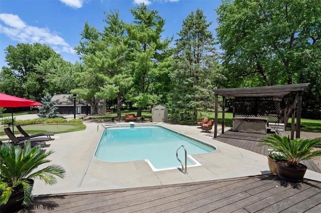 pool featuring a hot tub and a wooden deck