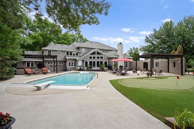 outdoor pool featuring a diving board, a patio, and a pergola